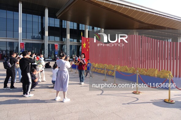 Tourists visit the International Sailing Center in Qingdao, China, on October 3, 2024. 