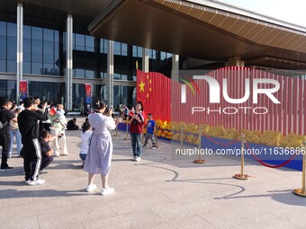 Tourists visit the International Sailing Center in Qingdao, China, on October 3, 2024. (