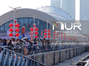 Tourists visit the International Sailing Center in Qingdao, China, on October 3, 2024. (