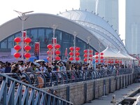 Tourists visit the International Sailing Center in Qingdao, China, on October 3, 2024. (