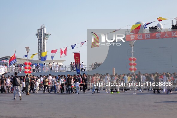 Tourists visit the International Sailing Center in Qingdao, China, on October 3, 2024. 