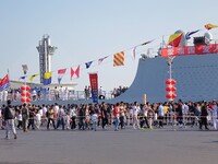 Tourists visit the International Sailing Center in Qingdao, China, on October 3, 2024. (