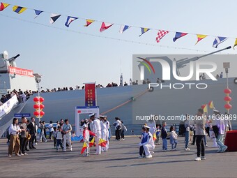 Tourists visit the International Sailing Center in Qingdao, China, on October 3, 2024. (