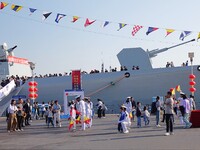 Tourists visit the International Sailing Center in Qingdao, China, on October 3, 2024. (