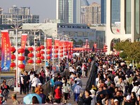 Tourists visit the International Sailing Center in Qingdao, China, on October 3, 2024. (