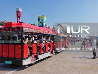 Tourists visit the International Sailing Center in Qingdao, China, on October 3, 2024. (