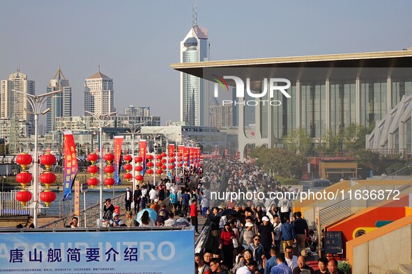 Tourists visit the International Sailing Center in Qingdao, China, on October 3, 2024. 