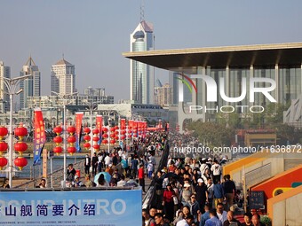 Tourists visit the International Sailing Center in Qingdao, China, on October 3, 2024. (