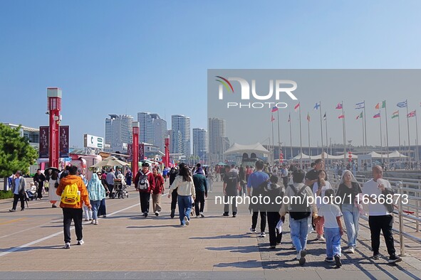 Tourists visit the International Sailing Center in Qingdao, China, on October 3, 2024. 