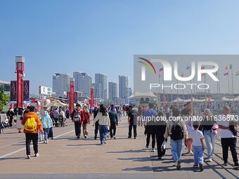 Tourists visit the International Sailing Center in Qingdao, China, on October 3, 2024. (