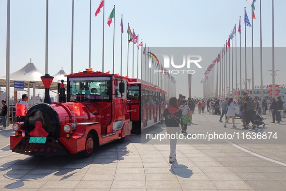 Tourists visit the International Sailing Center in Qingdao, China, on October 3, 2024. 