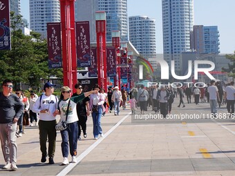 Tourists visit the International Sailing Center in Qingdao, China, on October 3, 2024. (