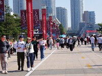 Tourists visit the International Sailing Center in Qingdao, China, on October 3, 2024. (