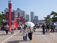 Tourists visit the International Sailing Center in Qingdao, China, on October 3, 2024. (