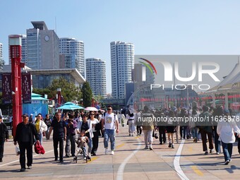 Tourists visit the International Sailing Center in Qingdao, China, on October 3, 2024. (