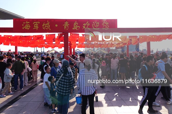 Tourists visit the International Sailing Center in Qingdao, China, on October 3, 2024. 