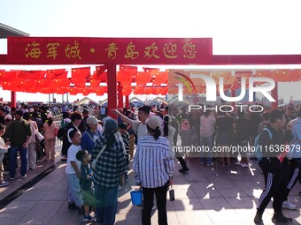 Tourists visit the International Sailing Center in Qingdao, China, on October 3, 2024. (