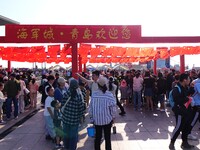 Tourists visit the International Sailing Center in Qingdao, China, on October 3, 2024. (