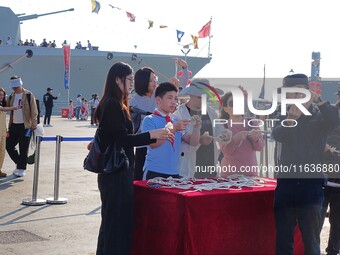 Tourists visit the International Sailing Center in Qingdao, China, on October 3, 2024. (