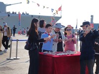 Tourists visit the International Sailing Center in Qingdao, China, on October 3, 2024. (