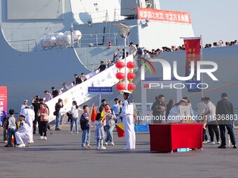 Tourists visit the International Sailing Center in Qingdao, China, on October 3, 2024. (