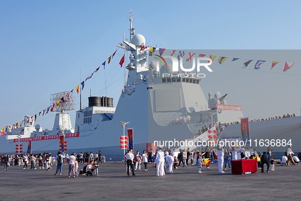 Tourists visit the International Sailing Center in Qingdao, China, on October 3, 2024. 