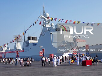 Tourists visit the International Sailing Center in Qingdao, China, on October 3, 2024. (