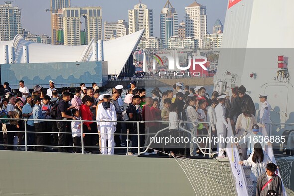 Tourists visit the International Sailing Center in Qingdao, China, on October 3, 2024. 