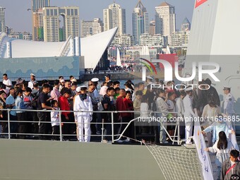 Tourists visit the International Sailing Center in Qingdao, China, on October 3, 2024. (