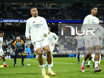 Kylian Mbappe centre-forward of Real Madrid and France and Jude Bellingham central midfield of Real Madrid and England during the warm-up be...