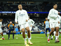 Kylian Mbappe centre-forward of Real Madrid and France and Jude Bellingham central midfield of Real Madrid and England during the warm-up be...