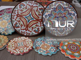 Uyghur handicrafts coasters are in Hami, Xinjiang province, China, on October 4, 2024. (