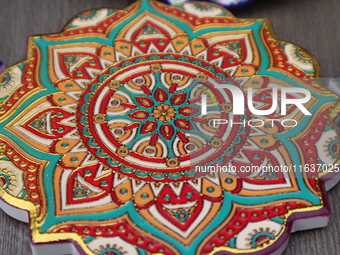 Uyghur handicrafts coasters are in Hami, Xinjiang province, China, on October 4, 2024. (