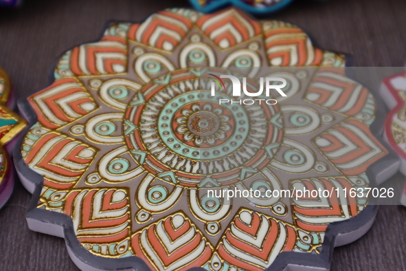 Uyghur handicrafts coasters are in Hami, Xinjiang province, China, on October 4, 2024. 