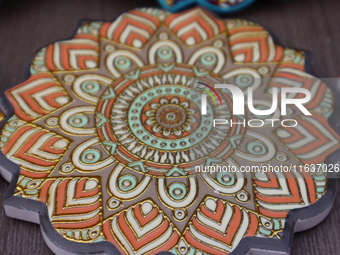 Uyghur handicrafts coasters are in Hami, Xinjiang province, China, on October 4, 2024. (