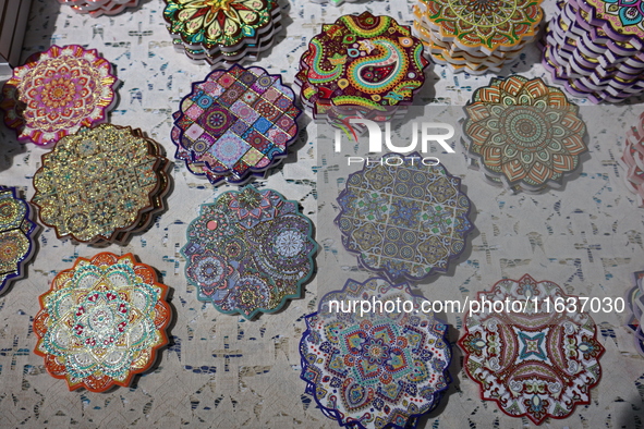 Uyghur handicrafts coasters are in Hami, Xinjiang province, China, on October 4, 2024. 