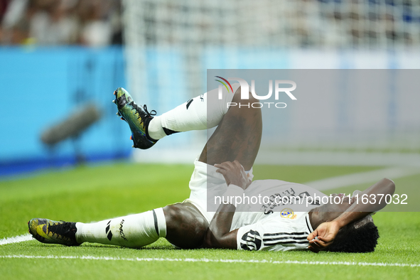 Vinicius Junior left winger of Real Madrid and Brazil lies injured on the pitch during the La Liga match between Real Madrid CF and Deportiv...