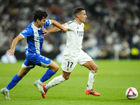 Lucas Vazquez right winger of Real Madrid and Spain and Manu Sanchez left-back of Alaves and Spain compete for the ball during the La Liga m...