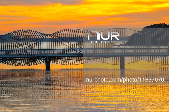 The Rainbow Bridge is seen by Tangdao Bay in the West Coast New Area of Qingdao, Shandong province, China, on October 5, 2024. 