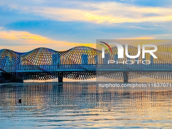 The Rainbow Bridge is seen by Tangdao Bay in the West Coast New Area of Qingdao, Shandong province, China, on October 5, 2024. (