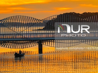 The Rainbow Bridge is seen by Tangdao Bay in the West Coast New Area of Qingdao, Shandong province, China, on October 5, 2024. (