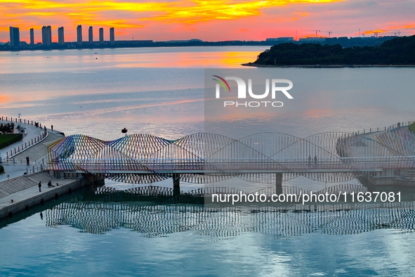 The Rainbow Bridge is seen by Tangdao Bay in the West Coast New Area of Qingdao, Shandong province, China, on October 5, 2024. 