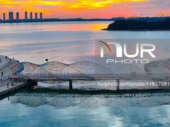 The Rainbow Bridge is seen by Tangdao Bay in the West Coast New Area of Qingdao, Shandong province, China, on October 5, 2024. (