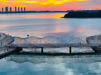 The Rainbow Bridge is seen by Tangdao Bay in the West Coast New Area of Qingdao, Shandong province, China, on October 5, 2024. (