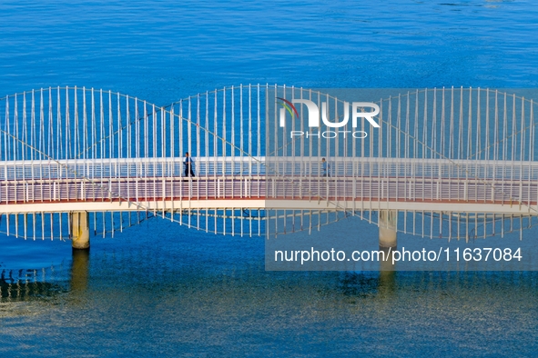 The Rainbow Bridge is seen by Tangdao Bay in the West Coast New Area of Qingdao, Shandong province, China, on October 5, 2024. 