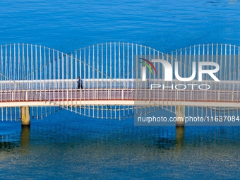 The Rainbow Bridge is seen by Tangdao Bay in the West Coast New Area of Qingdao, Shandong province, China, on October 5, 2024. (