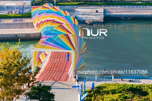 The Rainbow Bridge is seen by Tangdao Bay in the West Coast New Area of Qingdao, Shandong province, China, on October 5, 2024. 