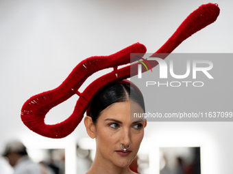 Supermodel Cindy Sirinya Bishop prepares backstage before walking on the runway during Day 3 of Bangkok International Fashion Week at Siam P...