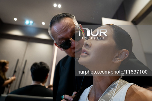 Metinee 'Lukkade' Kingpayom speaks to the media backstage before walking on the runway during Day 3 of Bangkok International Fashion Week at...