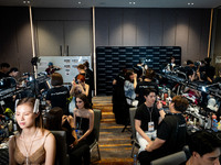 Models prepare backstage before walking on the runway during Day 3 of Bangkok International Fashion Week at Siam Paragon in Bangkok, Thailan...